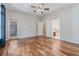Open main bedroom showcasing hardwood floors, tray ceilings, and lots of natural light at 660 Gran Heritage Way, Dacula, GA 30019