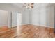 Spacious main bedroom featuring hardwood floors, neutral walls, and a ceiling fan at 660 Gran Heritage Way, Dacula, GA 30019