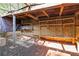 Rustic outdoor storage featuring shelving and a bench in a natural setting at 660 Gran Heritage Way, Dacula, GA 30019