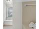 Bright bathroom area with soaking tub and window seat at 9055 Carroll Manor Dr, Sandy Springs, GA 30350