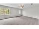 Spacious bedroom with large window offering natural light and scenic views at 9055 Carroll Manor Dr, Sandy Springs, GA 30350