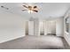 Large bedroom showcasing a ceiling fan, closet, and access to a bathroom at 9055 Carroll Manor Dr, Sandy Springs, GA 30350