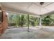 Covered patio with brick columns and a serene wooded view at 9055 Carroll Manor Dr, Sandy Springs, GA 30350