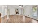 Bright living room with wood flooring and a fireplace at 9055 Carroll Manor Dr, Sandy Springs, GA 30350