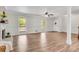Open living room showcasing the newly installed floors, fireplace, and bright lighting at 9055 Carroll Manor Dr, Sandy Springs, GA 30350