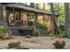 Brick home exterior with an inviting deck, beautiful landscaping and potted flowers at 1850 Winchester Trl, Brookhaven, GA 30341