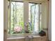 Bright bathroom showcases a clawfoot tub, offering a serene bathing experience with views of the nature at 1850 Winchester Trl, Brookhaven, GA 30341