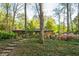 Backyard view of house, landscaping and stone pathway at 1850 Winchester Trl, Brookhaven, GA 30341