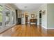 Bright living room with hardwood floors, French doors and multiple openings to other rooms in the house at 1850 Winchester Trl, Brookhaven, GA 30341