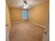 Cozy bedroom with a ceiling fan and a window for natural light at 445 Pintail Ct, Suwanee, GA 30024