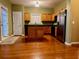 Kitchen with hardwood floors, stainless steel appliances, kitchen island and lots of light at 445 Pintail Ct, Suwanee, GA 30024