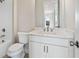 Cozy bathroom featuring a white vanity, toilet, and a classic subway-tiled shower/tub at 627 Skytop Dr, Cumming, GA 30040