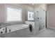 Modern bathroom featuring a glass-enclosed shower and luxurious soaking tub at 627 Skytop Dr, Cumming, GA 30040