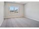 Bright bedroom with plush carpet, a large window, and plenty of natural light at 627 Skytop Dr, Cumming, GA 30040
