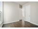 Bright bedroom boasts hardwood floors, neutral paint, and a sun-drenched window at 627 Skytop Dr, Cumming, GA 30040