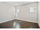 Neutral bedroom with wood floors, crisp trim, and bright windows at 627 Skytop Dr, Cumming, GA 30040