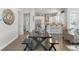 Open-concept living space featuring a dining area and modern kitchen at 627 Skytop Dr, Cumming, GA 30040