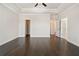 Large main bedroom features hardwood floors, a ceiling fan, and walk-in closet access at 627 Skytop Dr, Cumming, GA 30040