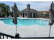 Community pool and nearby pergola offer a relaxing place to take a swim and escape the heat at 627 Skytop Dr, Cumming, GA 30040