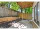 Cozy backyard patio with a wooden fence and lush landscaping at 906 Mcdaniel St, Atlanta, GA 30310