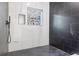 Sleek bathroom featuring marble-look tiling, window, and black fixtures at 906 Mcdaniel St, Atlanta, GA 30310
