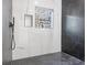 Modern shower featuring sleek black and white tiling, a unique window view, and high-end fixtures for a luxurious feel at 906 Mcdaniel St, Atlanta, GA 30310