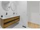 Elegant bathroom featuring double sinks with vessel bowls on a wood vanity and patterned tile floor at 906 Mcdaniel St, Atlanta, GA 30310