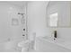 Modern bathroom featuring a geometric tile floor, bathtub with shower, and sleek vanity with gold faucet at 906 Mcdaniel St, Atlanta, GA 30310