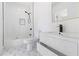 Modern bathroom with stylish tile flooring and sleek fixtures including an open vanity and tub shower at 906 Mcdaniel St, Atlanta, GA 30310