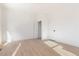 Spacious bedroom with light wood floors and white walls offers a bright and airy feel at 906 Mcdaniel St, Atlanta, GA 30310