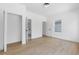 Bright bedroom featuring an ensuite bathroom, closet, and light hardwood flooring at 906 Mcdaniel St, Atlanta, GA 30310