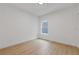Clean bedroom with light wood floors and a window offering natural light at 906 Mcdaniel St, Atlanta, GA 30310