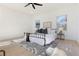 Bright and airy bedroom featuring a wrought iron bed frame, modern decor, and ample natural light from large windows at 906 Mcdaniel St, Atlanta, GA 30310