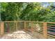 Relax on the wooden deck surrounded by lush greenery providing privacy at 906 Mcdaniel St, Atlanta, GA 30310