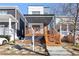 Modern home with a covered front porch, wooden stairs, and xeriscaped yard at 906 Mcdaniel St, Atlanta, GA 30310