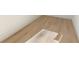 Close up of light, wood-look floors with white baseboards at 906 Mcdaniel St, Atlanta, GA 30310