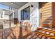 Stylish front porch with a wooden bench, decorative pillows, and modern front door at 906 Mcdaniel St, Atlanta, GA 30310