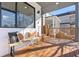 Charming front porch featuring a wooden bench, decorative pillows, and ample sunlight at 906 Mcdaniel St, Atlanta, GA 30310