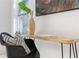 A modern chair and desk is situated near the window and complements the decor and abstract wall art at 906 Mcdaniel St, Atlanta, GA 30310