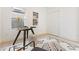Bright home office features a modern glass desk and stylish decor on wood floors and white walls at 906 Mcdaniel St, Atlanta, GA 30310