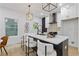 The modern kitchen boasts an island with sleek countertops and a stylish black and white design at 906 Mcdaniel St, Atlanta, GA 30310
