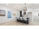 Modern kitchen featuring a sleek island with bar seating and stylish pendant lighting at 906 Mcdaniel St, Atlanta, GA 30310
