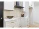 Close-up view of a kitchen showcasing the updated tile backsplash and white cabinets at 906 Mcdaniel St, Atlanta, GA 30310