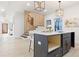 Modern kitchen with black cabinets, white countertops, pendant lighting and modern staircase at 906 Mcdaniel St, Atlanta, GA 30310