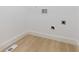 A dedicated laundry room features hookups ready for modern appliances and light wood floors at 906 Mcdaniel St, Atlanta, GA 30310