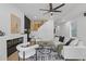 Beautiful living room with fireplace, modern sofas, and a staircase with wooden railings at 906 Mcdaniel St, Atlanta, GA 30310