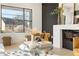 Bright living room with a modern fireplace, textured accent wall, and contemporary furnishings at 906 Mcdaniel St, Atlanta, GA 30310