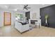 The living room features hardwood floors, white sofas, and a decorative fireplace at 906 Mcdaniel St, Atlanta, GA 30310