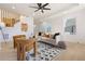 Open-concept living area with lots of light, a comfortable sofa, stylish chairs, hardwood floors and modern recessed lighting at 906 Mcdaniel St, Atlanta, GA 30310