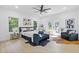 Sun-drenched main bedroom features bleached-wood floors, ceiling fan, and balcony access at 906 Mcdaniel St, Atlanta, GA 30310